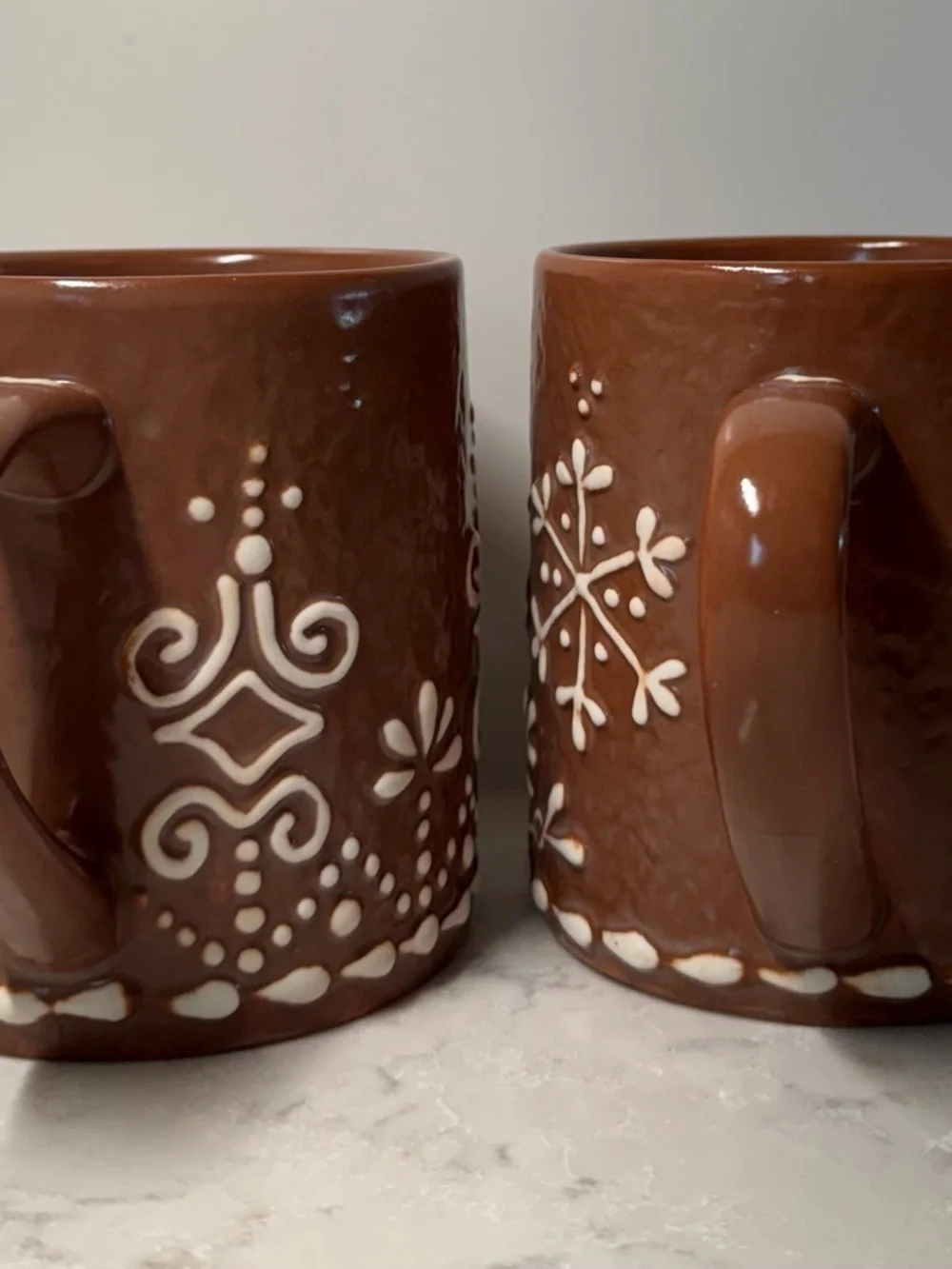 Pottery Barn Brown Ceramic Mug with White Snowflake Design